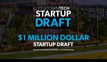 A promotional image for TitletownTech's Startup Draft, featuring large text that reads "$1 Million Dollar Startup Draft" over a background of a football field and surrounding campus. A subheading says, "Green Bay is drafting more than athletes – we're drafting startups."