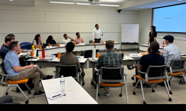 Group of professionals from Innovation Crossroads and Spark celebrating the launch of their joint programming initiative.